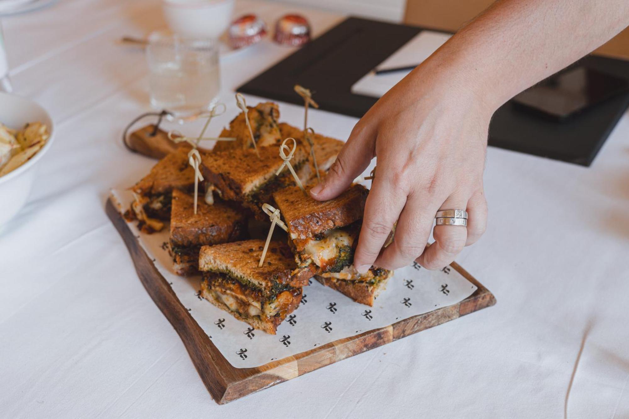 No 15 By Guesthouse, Bath Eksteriør billede A hand picking up a canapé